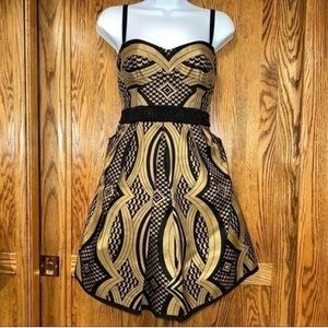 Nanette Lepore size 2. Gorgeous Black and gold Cocktail dress . Beaded waist .